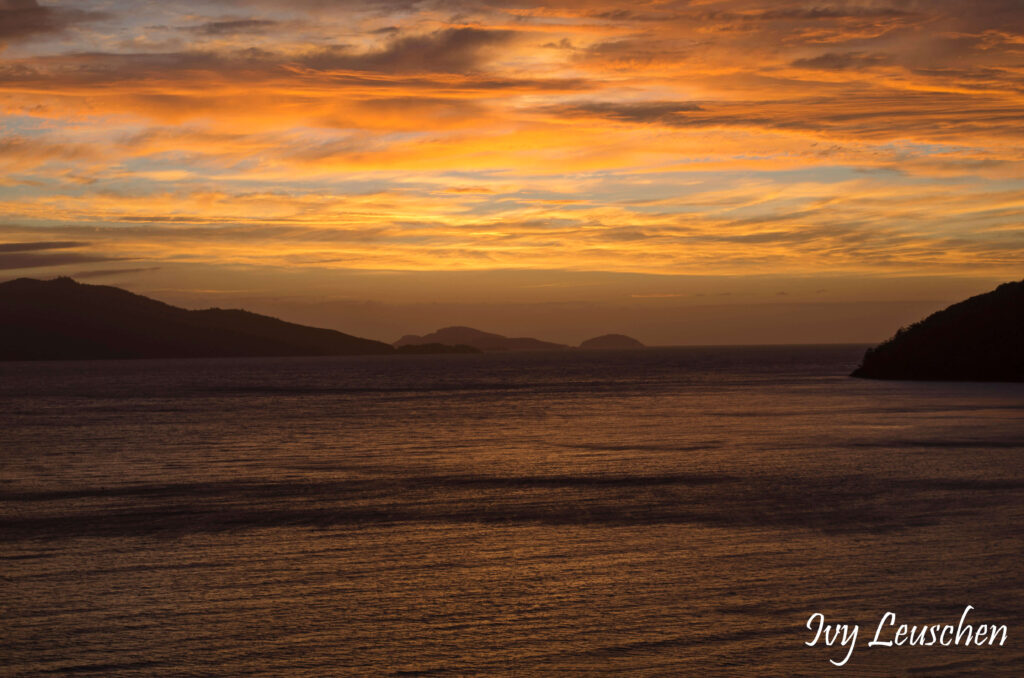 Orange and yellow sunrise over water