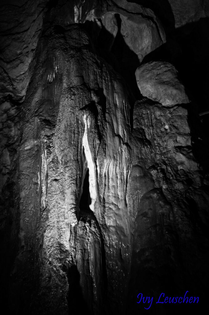 Hole in rock formation, black and white