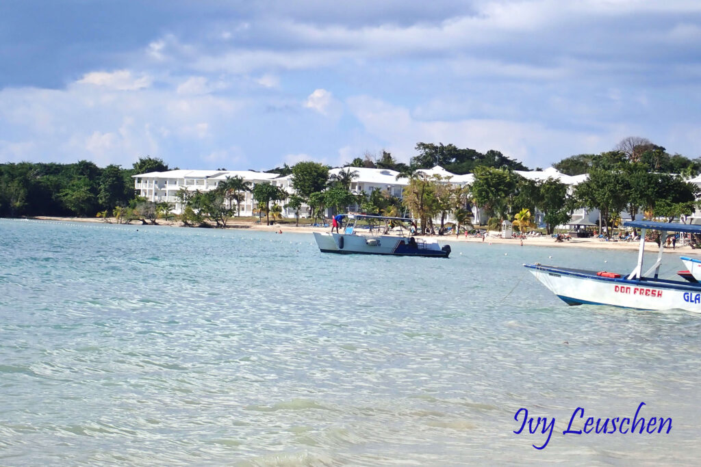 Boats on water in front of hotel