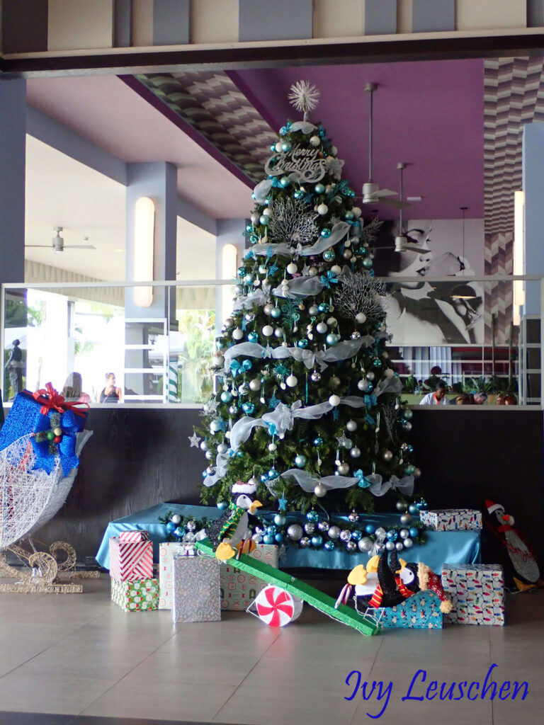 Christmas tree with presents in lobby