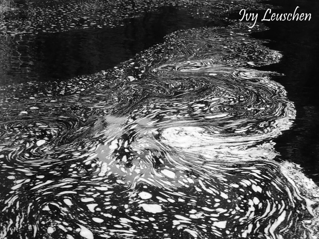 Foam design on water, black and white