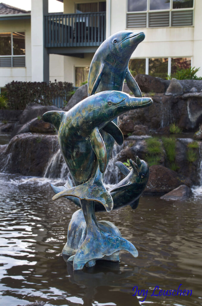Three dolphins statue